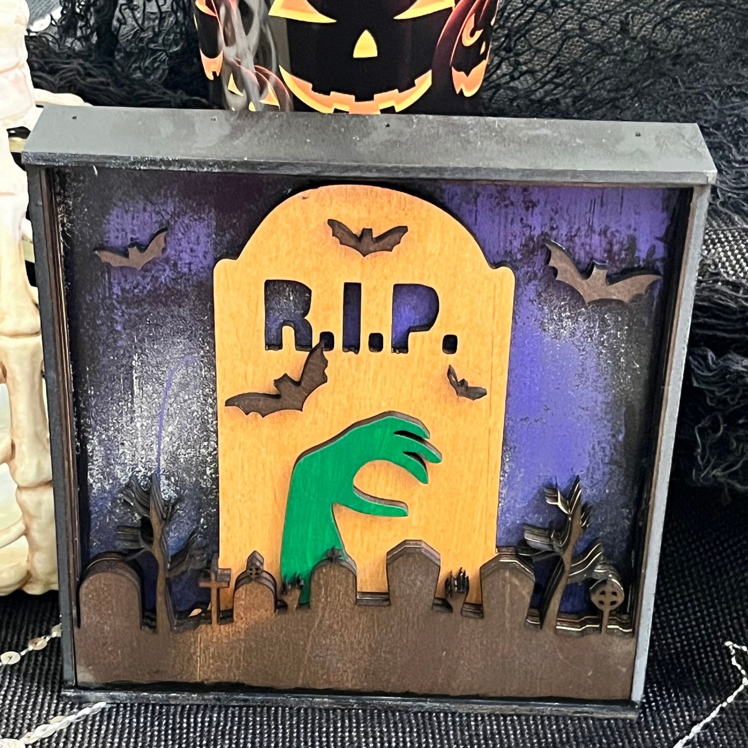 Halloween Mantel Decor Featuring a Graveyard and Tombstone Design