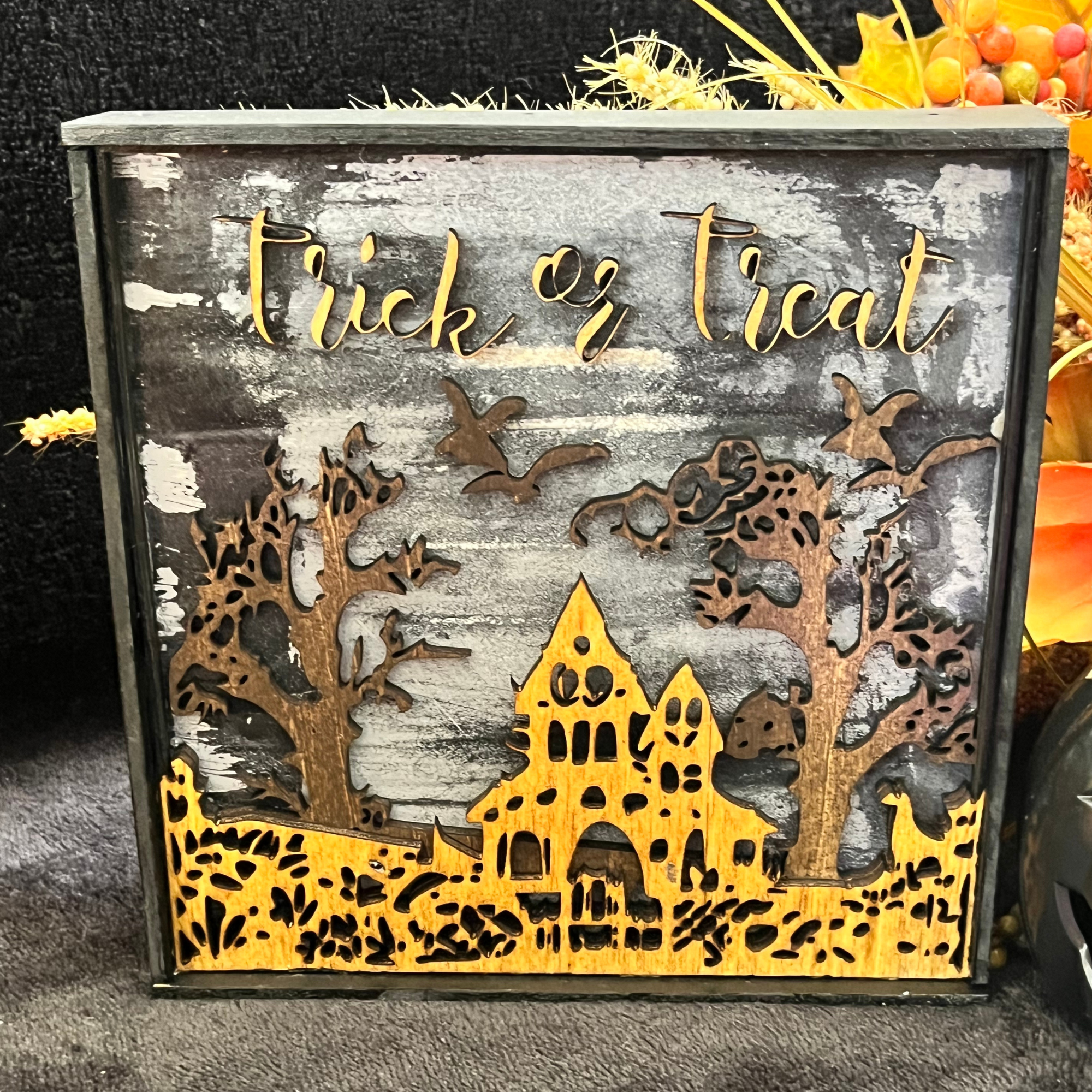 Spooky Halloween House with Bats and Trick or Treat message; featuring layered wood - close up image.