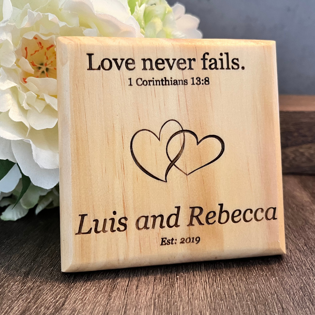 Product image for Wooden Coaster Bible Verse Personalized for Wedding or Anniversary.  Shows bible verse 1 Corinthians 13:8 &