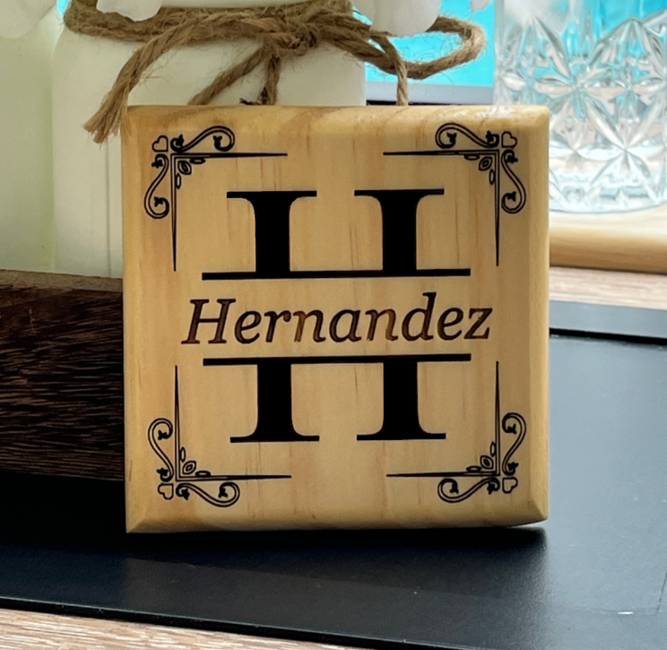 Hand made wooden drink coaster laser engraved with a split monogram and custom text: Product Close Up Image